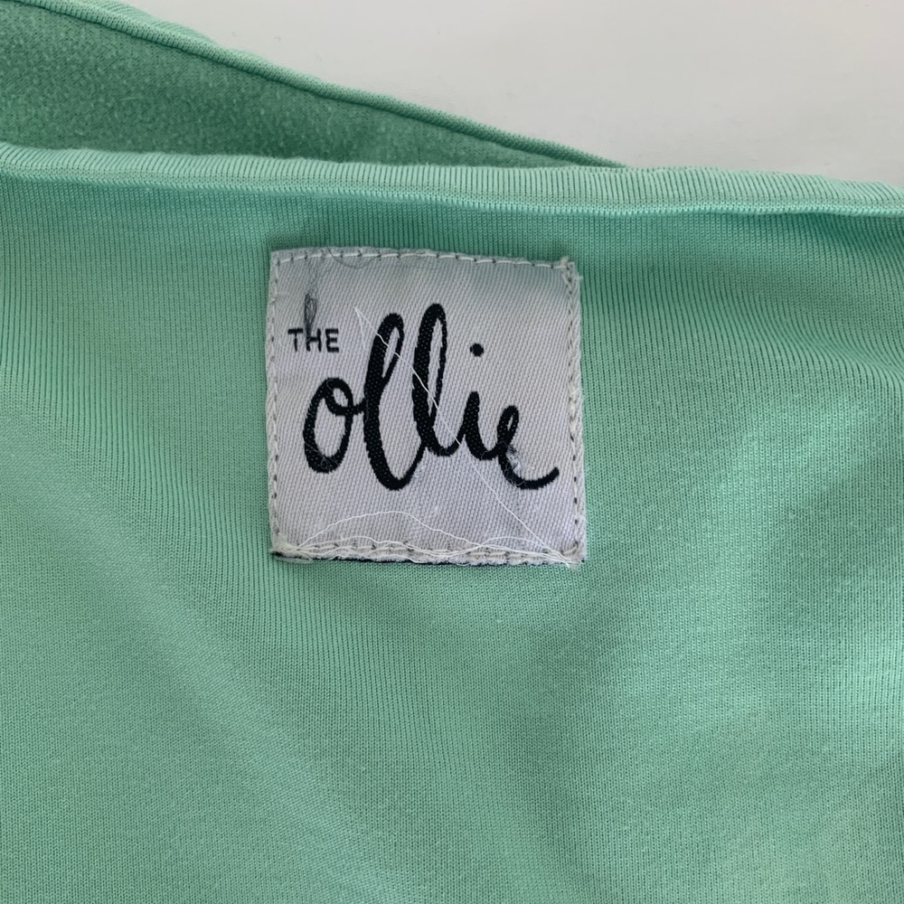 Ollie Swaddle. Mint (Meadow). Over or under arms. Velcro closure with tie bottom